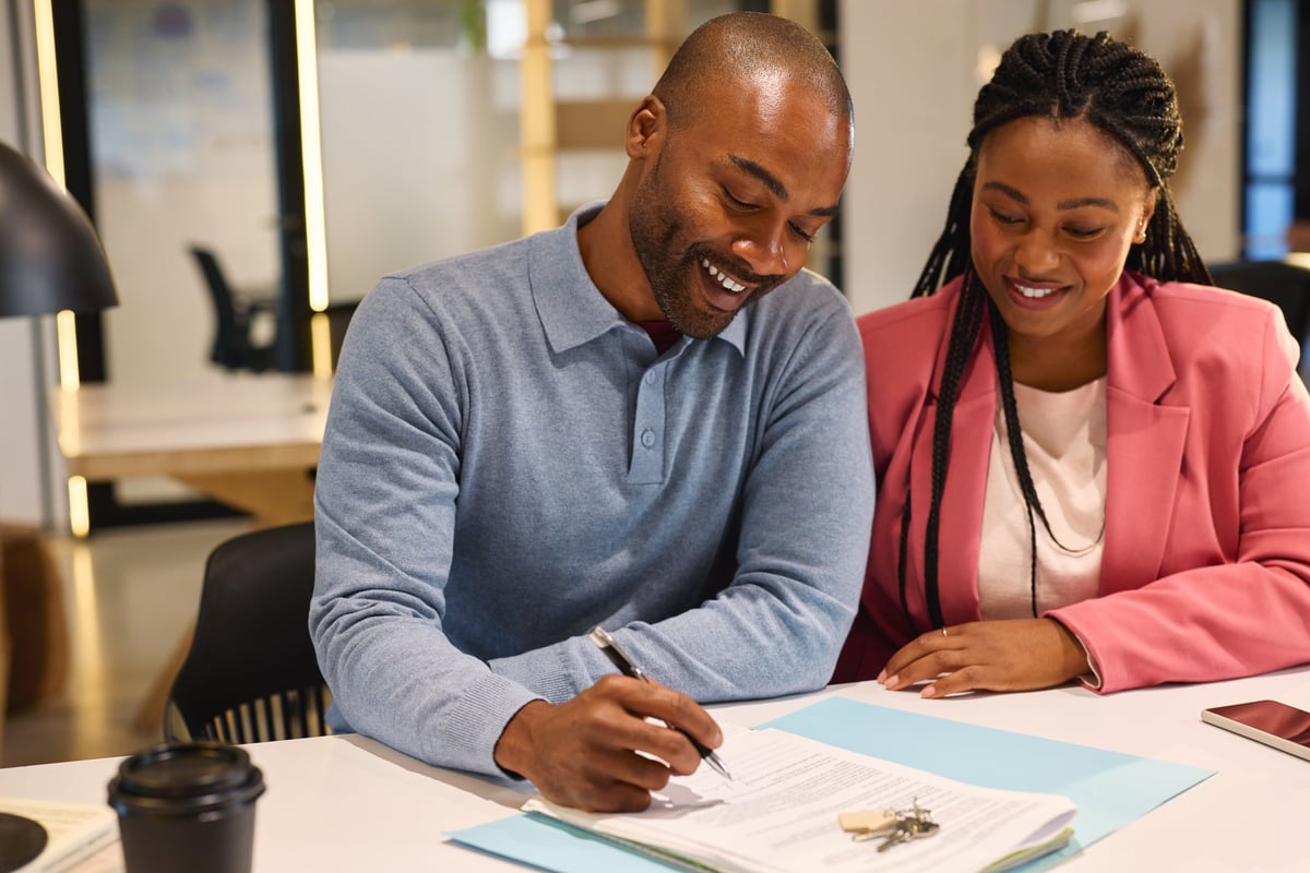 Professional signing agent working with clients on mortgage documents
